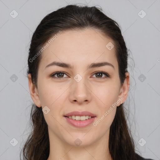 Joyful white young-adult female with long  brown hair and brown eyes