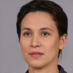 Joyful white adult female with short  brown hair and brown eyes