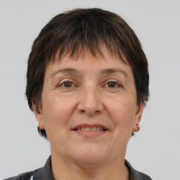 Joyful white middle-aged female with short  brown hair and brown eyes