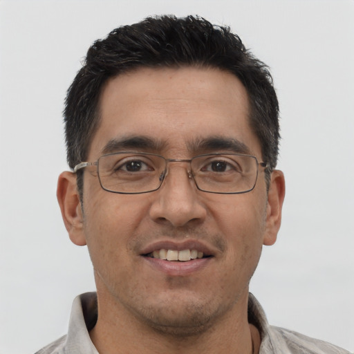 Joyful asian adult male with short  brown hair and brown eyes