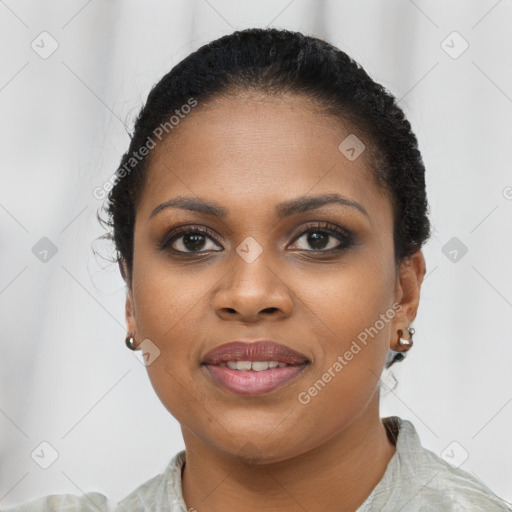 Joyful black young-adult female with short  brown hair and brown eyes