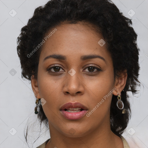 Joyful black young-adult female with long  brown hair and brown eyes