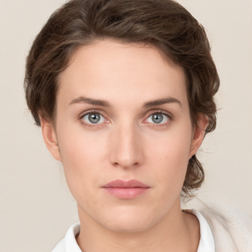 Neutral white young-adult female with short  brown hair and green eyes