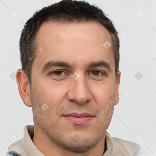 Joyful white adult male with short  brown hair and brown eyes