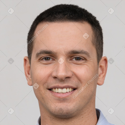 Joyful white young-adult male with short  brown hair and brown eyes