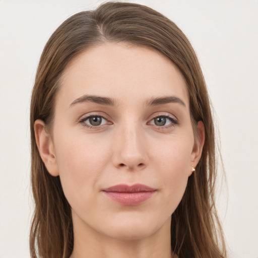 Joyful white young-adult female with long  brown hair and grey eyes