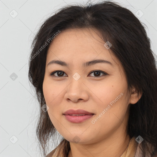 Joyful asian young-adult female with long  brown hair and brown eyes