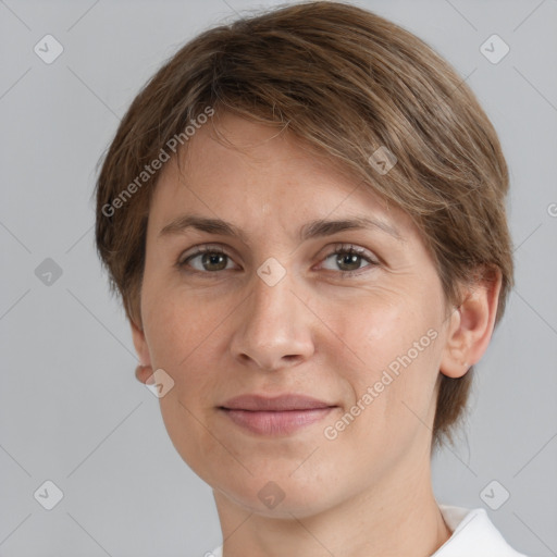 Joyful white adult female with short  brown hair and grey eyes