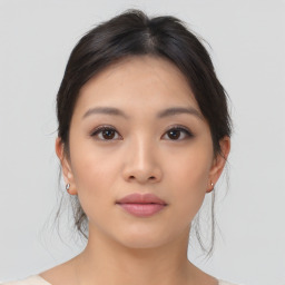 Neutral asian young-adult female with medium  brown hair and brown eyes