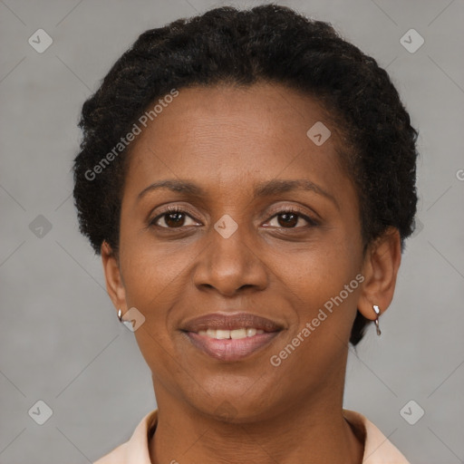 Joyful latino adult female with short  brown hair and brown eyes