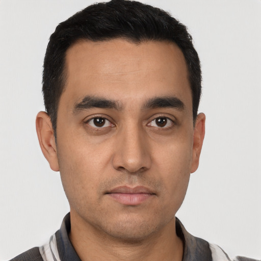 Neutral latino young-adult male with short  black hair and brown eyes