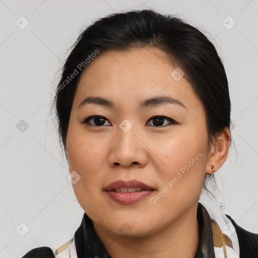 Joyful asian young-adult female with medium  brown hair and brown eyes