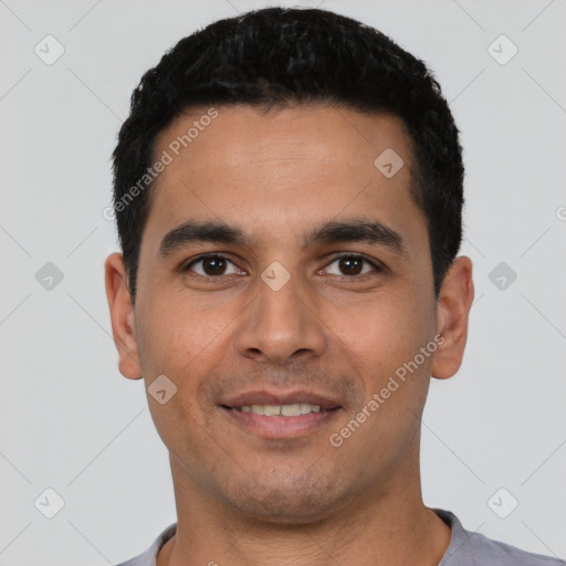 Joyful white young-adult male with short  black hair and brown eyes