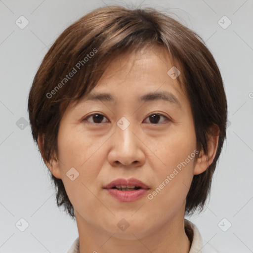 Joyful white adult female with medium  brown hair and brown eyes