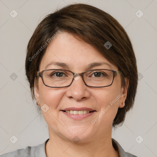 Joyful white adult female with medium  brown hair and grey eyes