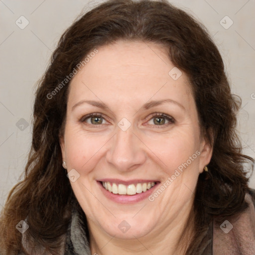 Joyful white adult female with long  brown hair and brown eyes