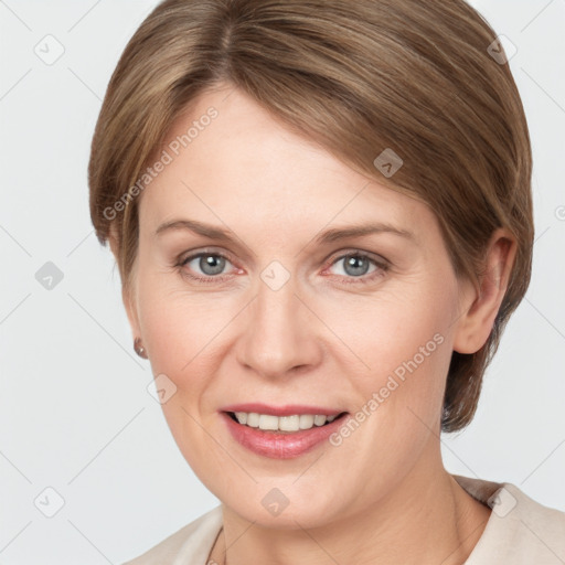 Joyful white adult female with medium  brown hair and grey eyes