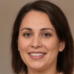 Joyful white adult female with medium  brown hair and brown eyes