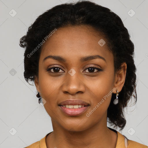 Joyful black young-adult female with long  black hair and brown eyes