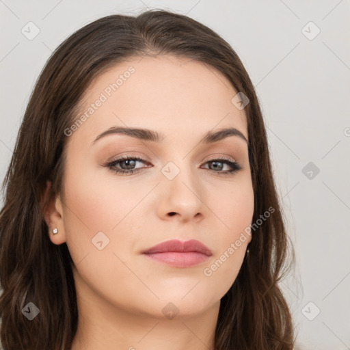 Neutral white young-adult female with long  brown hair and brown eyes