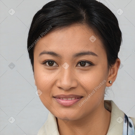 Joyful asian young-adult female with short  brown hair and brown eyes