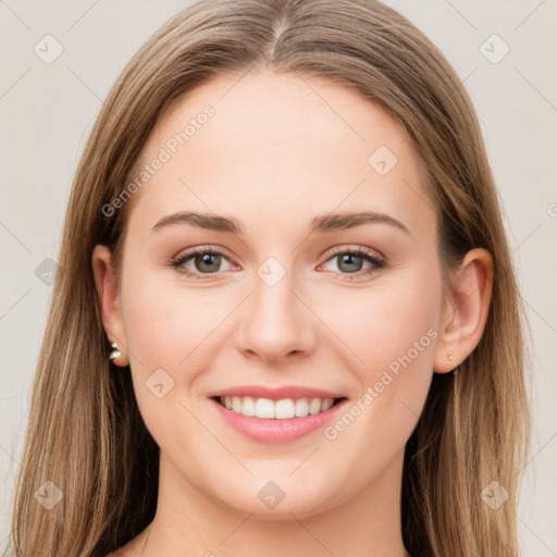 Joyful white young-adult female with long  brown hair and green eyes