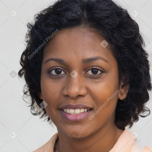 Joyful black young-adult female with long  brown hair and brown eyes