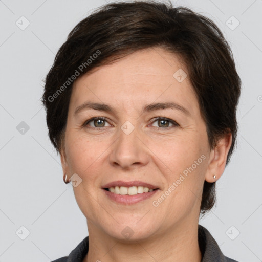 Joyful white adult female with medium  brown hair and grey eyes