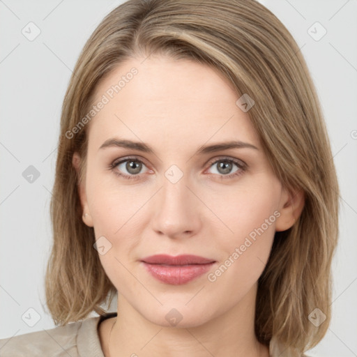 Joyful white young-adult female with medium  brown hair and green eyes