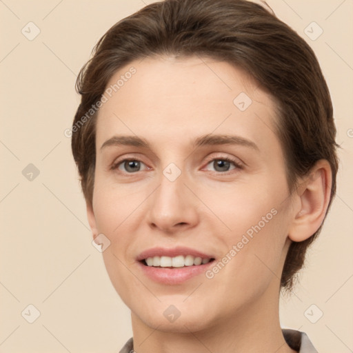 Joyful white young-adult female with short  brown hair and brown eyes