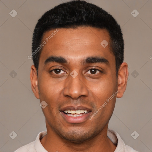 Joyful black young-adult male with short  black hair and brown eyes