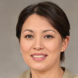 Joyful white young-adult female with medium  brown hair and brown eyes