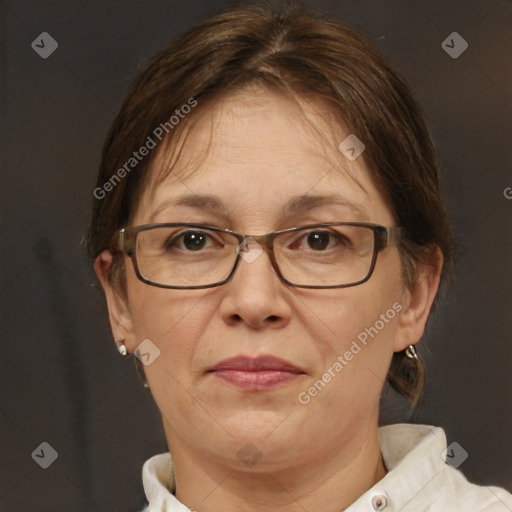 Joyful white adult female with short  brown hair and brown eyes