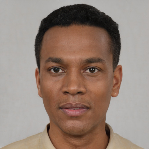 Neutral black young-adult male with short  black hair and brown eyes