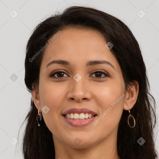 Joyful latino young-adult female with long  brown hair and brown eyes