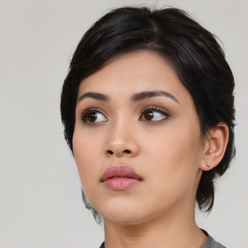 Neutral asian young-adult female with medium  black hair and brown eyes