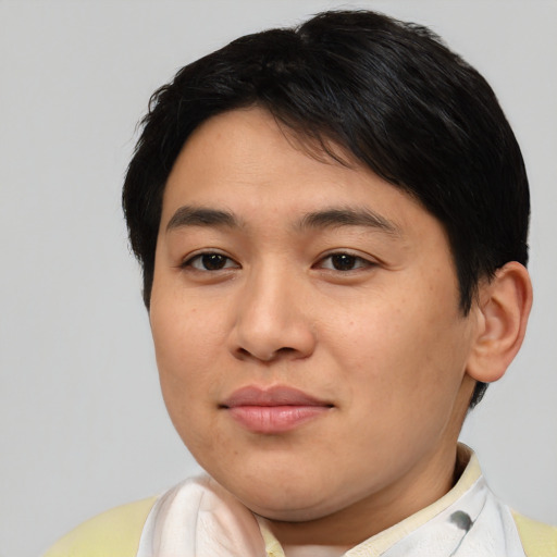 Joyful asian young-adult male with short  brown hair and brown eyes