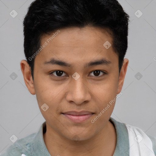 Joyful latino young-adult male with short  brown hair and brown eyes