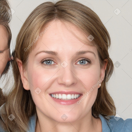 Joyful white young-adult female with medium  brown hair and blue eyes