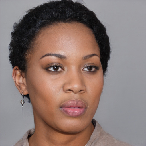 Neutral black young-adult female with short  black hair and brown eyes