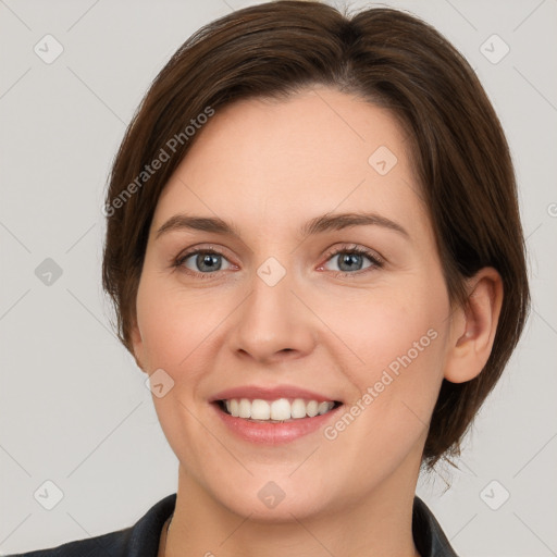 Joyful white young-adult female with medium  brown hair and grey eyes