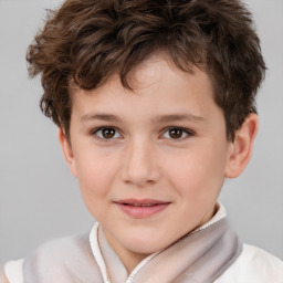 Joyful white child male with short  brown hair and brown eyes