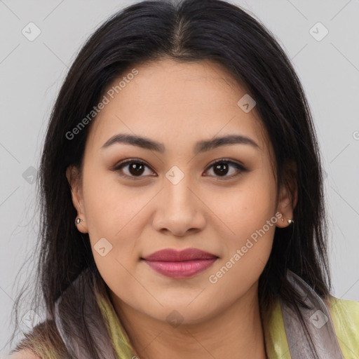 Joyful asian young-adult female with long  brown hair and brown eyes