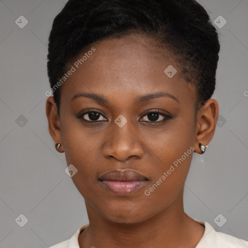 Joyful black young-adult female with short  brown hair and brown eyes