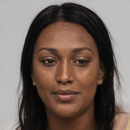 Joyful asian young-adult female with long  brown hair and brown eyes