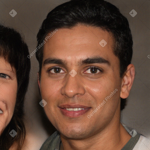 Joyful white young-adult male with short  black hair and brown eyes