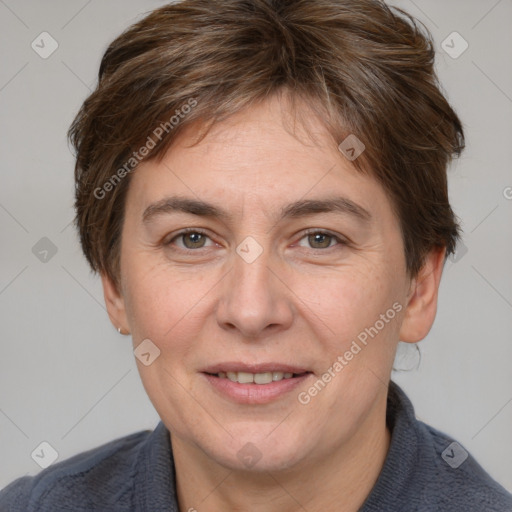 Joyful white adult female with short  brown hair and brown eyes