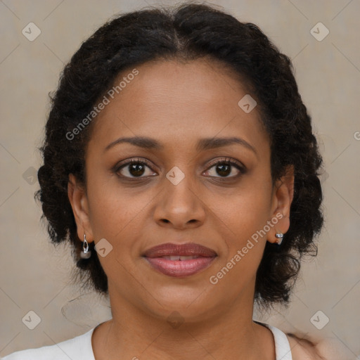 Joyful black young-adult female with medium  brown hair and brown eyes