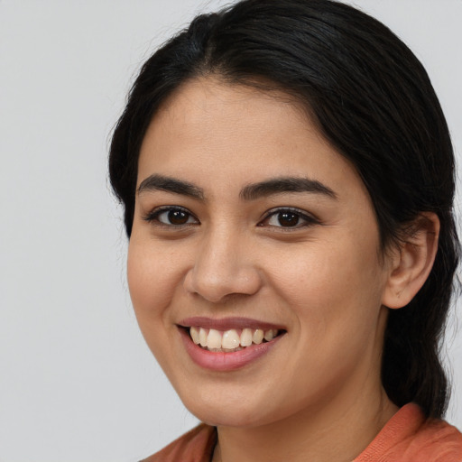 Joyful asian young-adult female with medium  brown hair and brown eyes