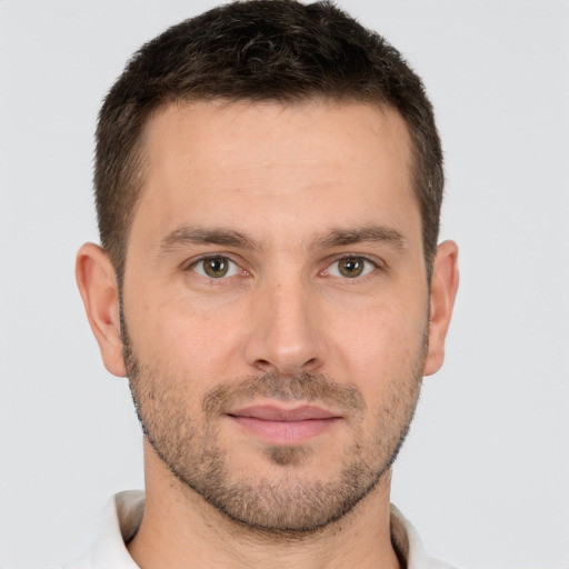 Joyful white young-adult male with short  brown hair and brown eyes